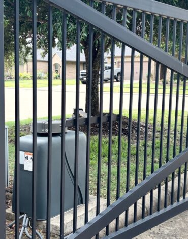 Custom steel fence and driveway gate installed at a residential property in Austin, TX