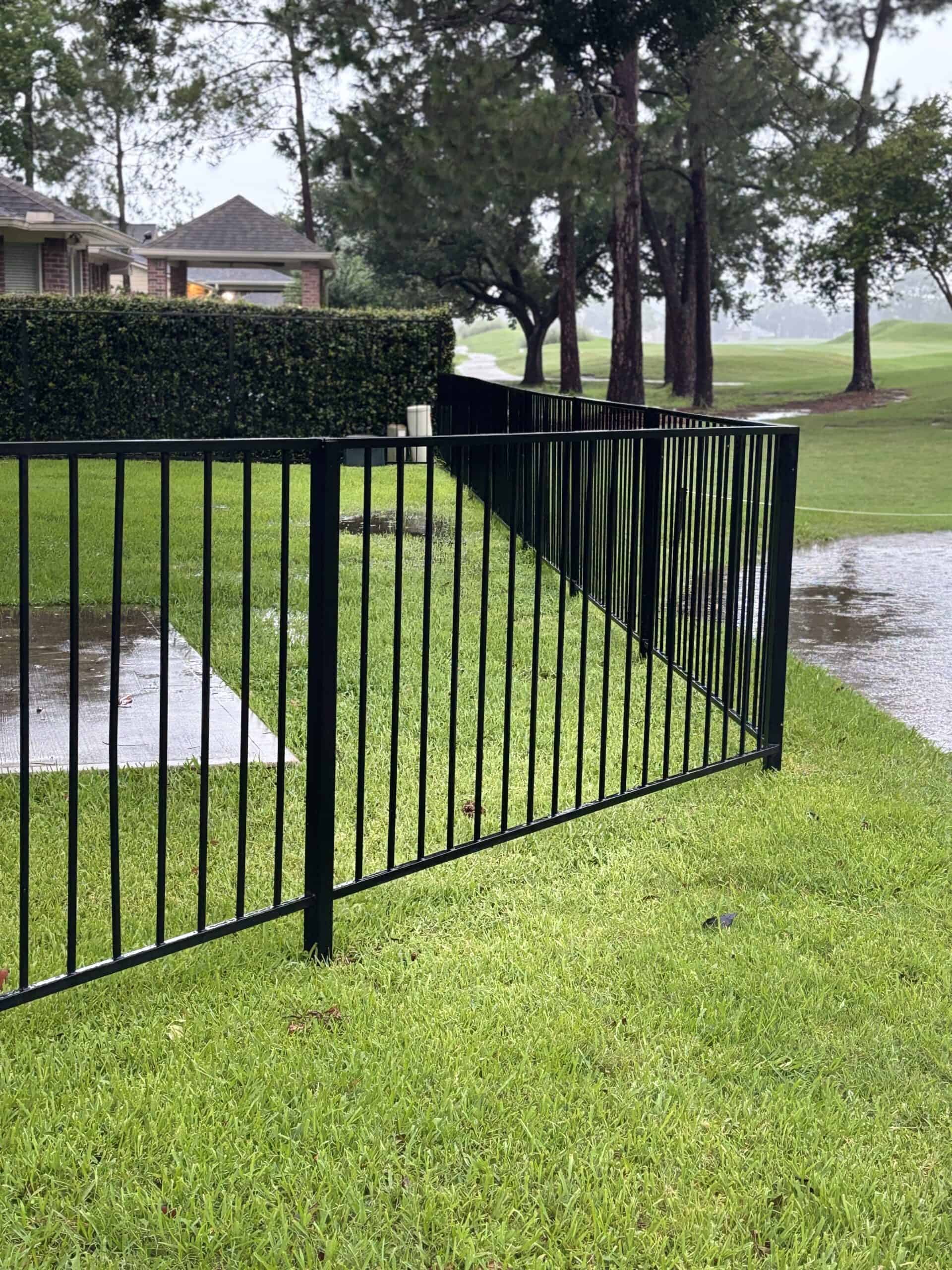 Black steel fence panels installed along a residential property in Austin Texas