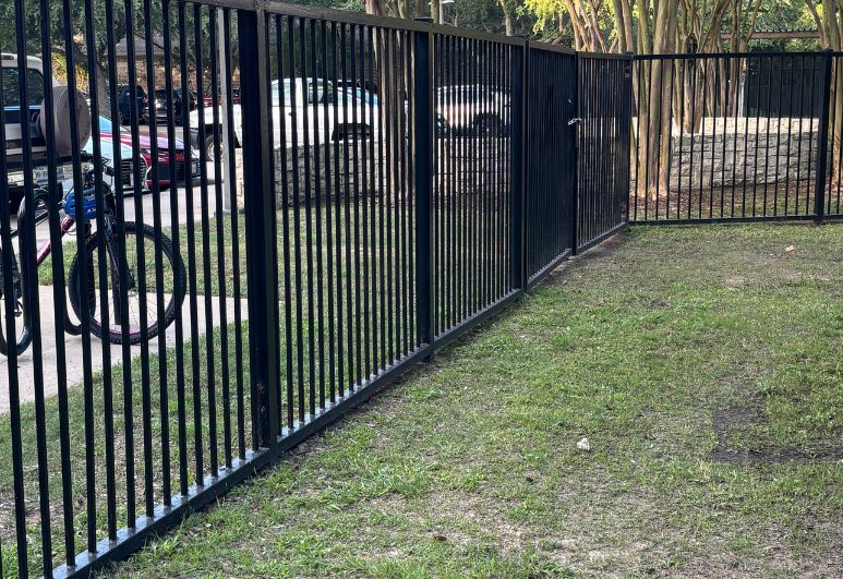Commercial steel fencing installed at a multifamily residential community in Austin, Texas featuring durable welded steel construction and secure perimeter protection.