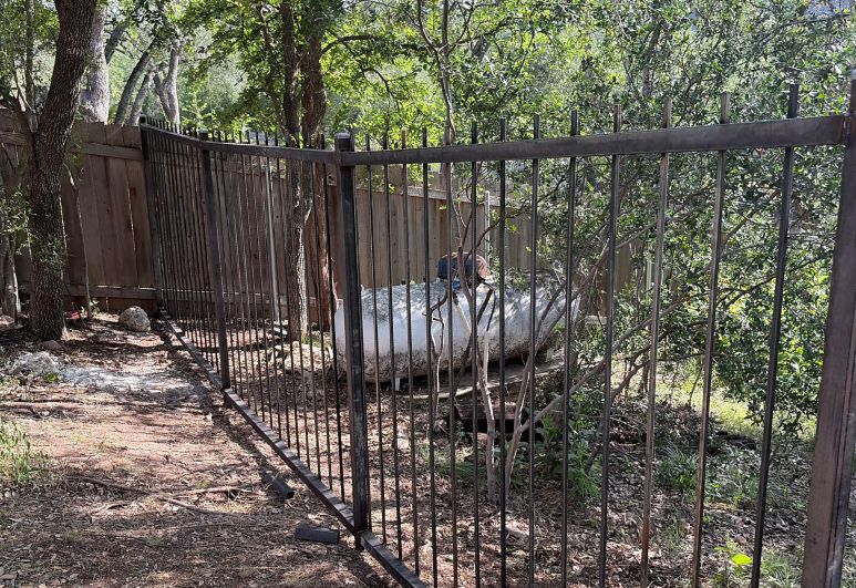 Custom modern horizontal steel fence installed at a residential property in Austin, Texas.